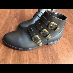 Black zip boots with buckle detail